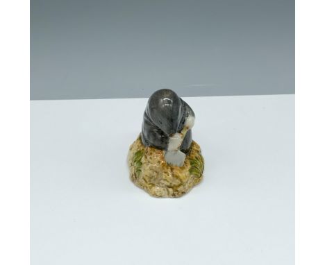 Glossy porcelain figure of a badger mole digging with a shovel. Royal Albert Beatrix Potter backstamp. This item has its orig