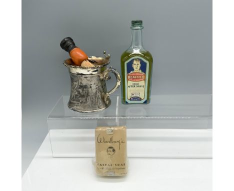 Handsome assortment of products that include a two piece shaving mug, a Health O lilac after shave bottle, a Woodburys facial
