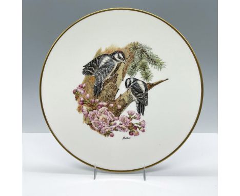 A stunning depiction of two woodpeckers in a tree on fine English bone China with gold band around rim. This item has its ori