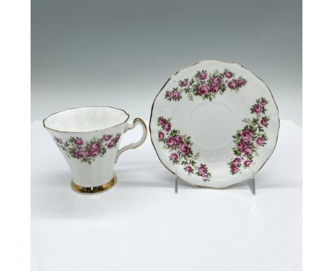 English white cup and saucer set adorned with pink roses and gilded trim accents. Royal Adderley backstamps. Cup: 4.25"L x 3.