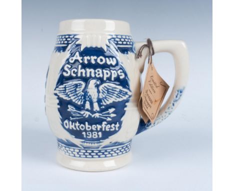 This limited edition stein was created in 1981 to commemorate Oktoberfest. The stein is ivory and blue with an eagle holding 