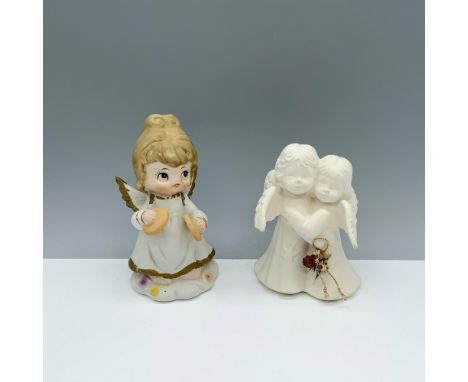 Dainty duo of figures depicting a robed girl with cymbals and a pair of winged figures in an embrace. Larger item measures 3"