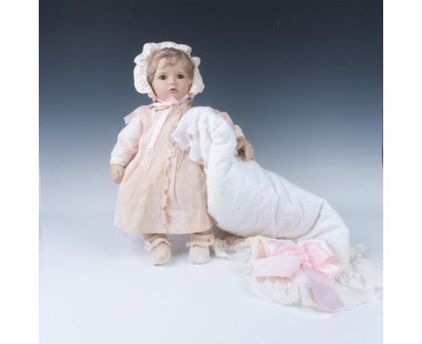 Dressed for her first role in hand-tailored and embroidered gown, booties and bonnet. Blanket is white with eyelet edge and p