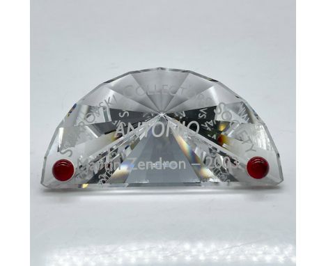Half-moon cut crystal with corner red crystal, announcing 2003 Antonio. Swarovski backstamp. 626472. This item has its origin
