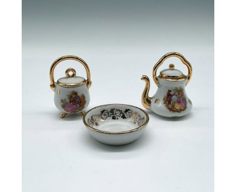 White porcelain pieces decorated with garden scenes and gilt accents. Collection includes bowl (2"); pot with cover (2.25"); 