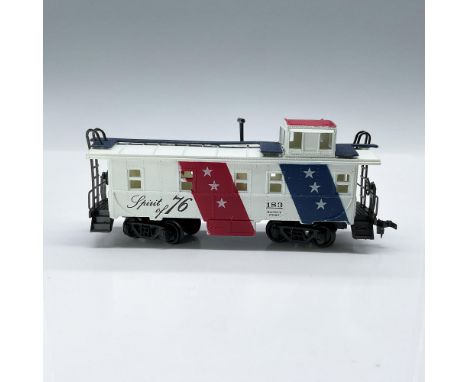 This is a HO scale train car in red, white, and blue, marked Spirit of 76, 183 Safety First on the side. This item has its or
