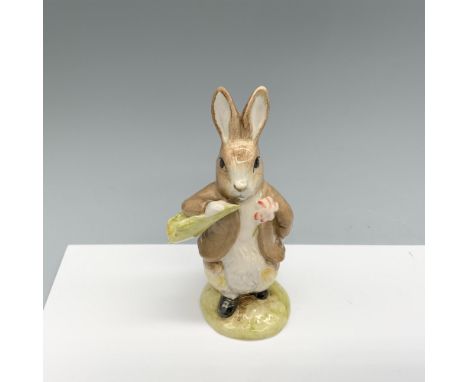 Glossy porcelain figurine of a bunny wearing a jacket with a flower on it. Royal Albert Beatrix Potter backstamp. This item h