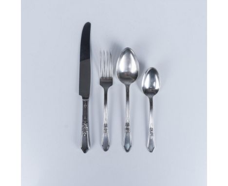 In a rose pattern. Set includes 6 dinner knives (9"L x 0.75"W x 0.5"H); 6 forks (7"L x 1"W x 1"H); 6 soup spoons (7"L x 1.5"W