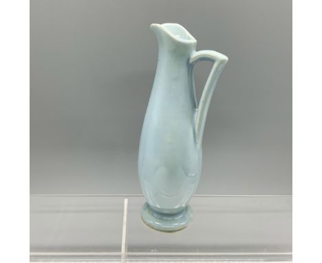 Adorable small vase with a handle that can be used as a pitcher as well. USA backstamped. Issued: 1930sDimensions: 2.5"L x 3.