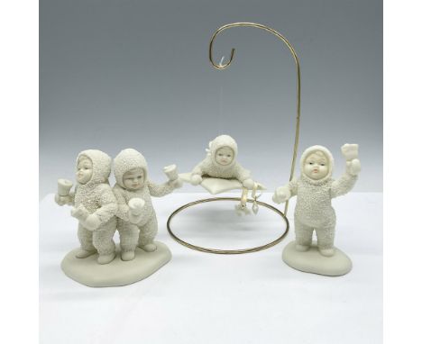 Adorable figures dressed in winter white holding bells and stars. This item has its original box: 10.5"L x 7"W x 3"H. Issued: