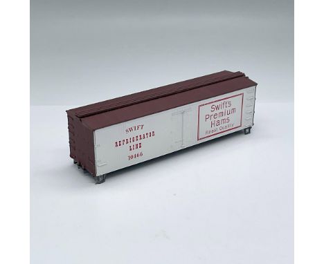 HO scale model kit comes with instructions and some parts. It is a replica of a 36 foot refrigerator car with an advertisemen