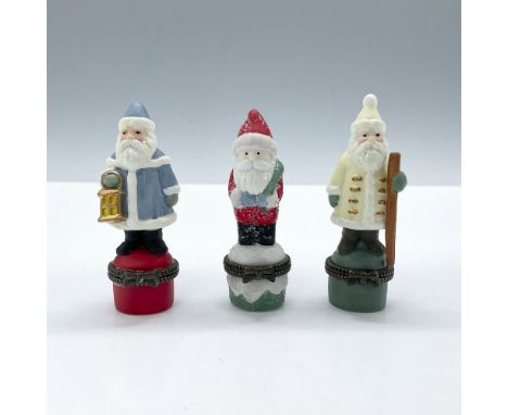 This beautiful trio of matte finish porcelain boxes features three versions of Santa Clauses in colorful holiday attire and d