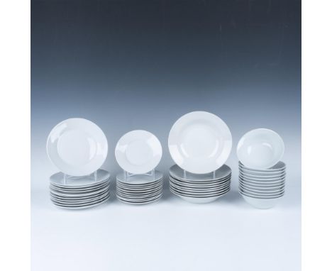 A set of 46 white Gibson kitchenware items, including 12 small bowls, 12 salad plates, 12 saucers, and 10 large bowls. Gibson