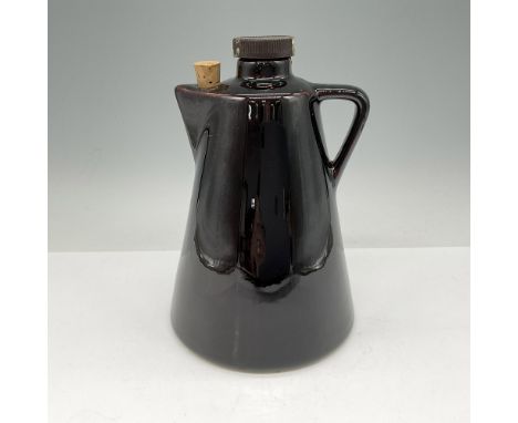 Brown glossy mid-century modern pitcher with top filler and corked spout. Issued: 1974Dimensions: 8"H x 5" dia. Manufacturer: