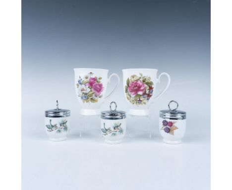 This charming tableware set includes three Royal Worcester egg cups featuring a bird and fruit motif, along with two Duchess 