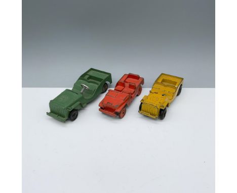 Pleasing and colorful metal assortment of orange and yellow Tootsietoy military vehicles alongside an army green Metal Master