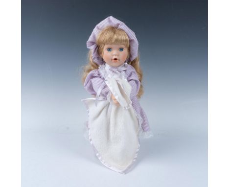 Young girl with long blonde hair dressed in lavender and white striped dress, kneeling in prayer. Display stand included. The