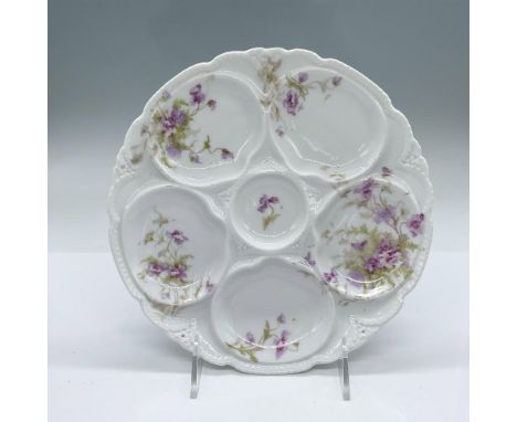 Porcelain oyster plate with a purple flower pattern. Theodore Haviland Limoges backstamp on the bottom. Issued: 1903-1925Dime