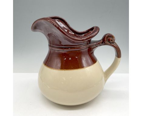 Bulbous pitcher designed with crockery glossy brown top and cream base. McCoy impressed mark. 7515. Issued: 20th centuryDimen