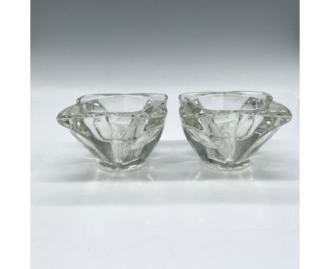 Clear shaped glass holder can be used for stick or tealight candles. Issued: 20th centuryDimensions: 3"L x 3"W x 2"HCondition