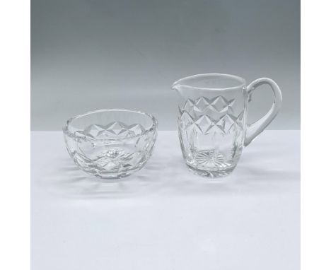 Beautifully cut crystal bowl and matching pitcher with handle. The bowl measures 2"H x 4"dia., and the pitcher measures 4.5"L