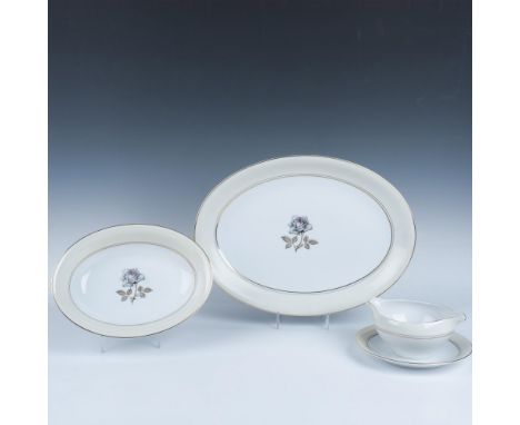 A set of 4 items that features a cream-colored outer ring and white center with elegant white roses adorned with pink accents