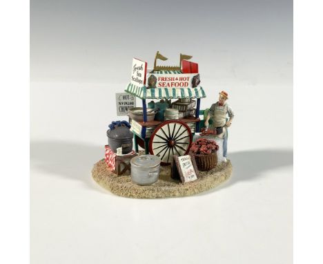 This is a lovely hand painted miniature of a Seafood Stand by Department 56. Along with its delightful color pallet, it conta