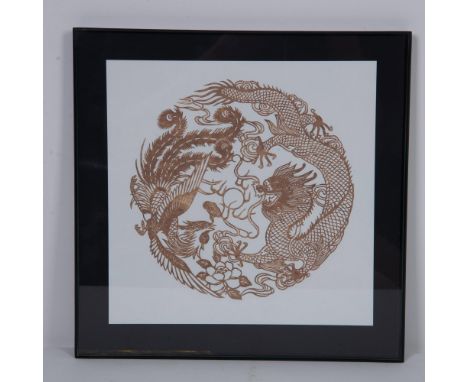 Original good fortune golden Chinese Dragon and Phoenix mandala paper cutout symbolizing the Yang and the Yin that complement