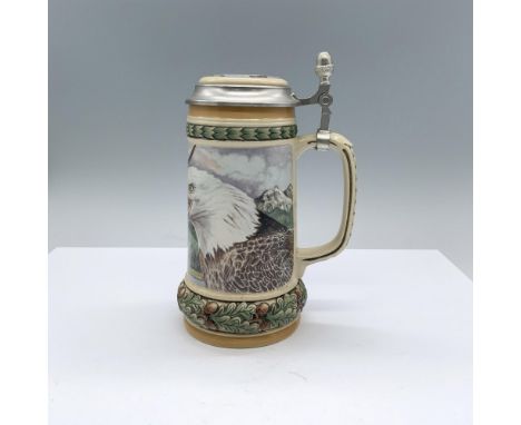 A German beer stein with a pewter lid. Depicts a majestic landscape with eagles. High reliefs of oak leaves and acorns on the
