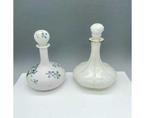 Gorgeous duo of containers decorated with flowers and adorned with their lids. Largest item measures 6.5"L x 9"H. Issued: 20t
