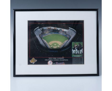 This color photo shows Yankee Stadium and a small picture in the corner of their immediate celebration. Also included is the 