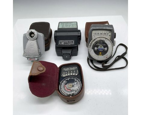 Lot includes Ricoh Flash adapter with case and cord (4"H); Gossen Lunasix light meter with case (4.5"H); Weston Master II uni