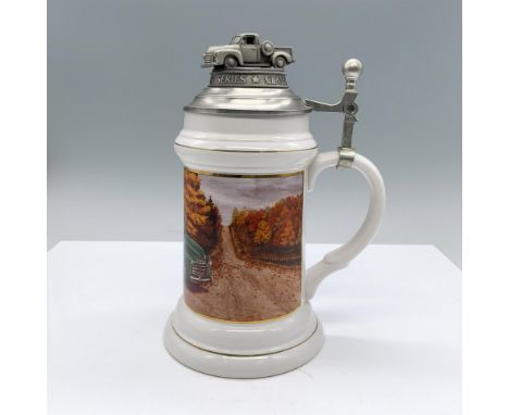 Limited edition piece, part of the Classical Car Series. White ceramic beer mug with pewter lid. The mug depicts a green 1953