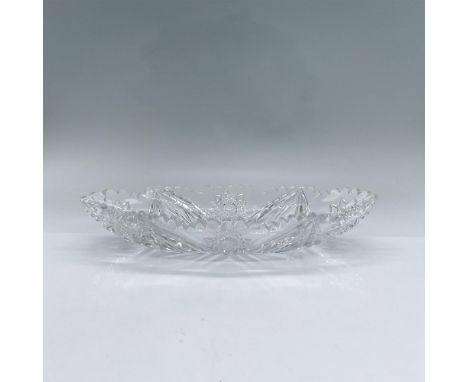 Thick clear cut oval glass serving dish with scalloped rim and sixteen pointed star engraved design. Dimensions: 11.25"L x 6.