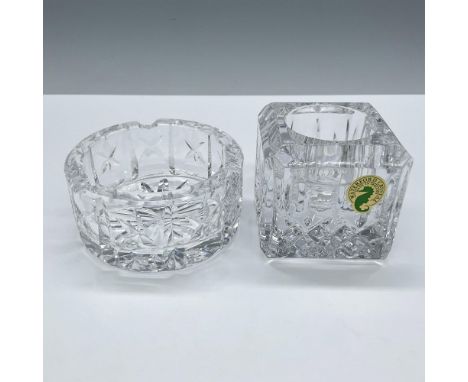 Gorgeous duo of facetted clear crystal in two different patterns. Features a cubic candleholder in the Lismore pattern and a 