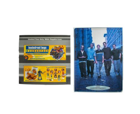 First is a store display showing the group as action figures included with a kid's meal. It is printed on card stock paper an