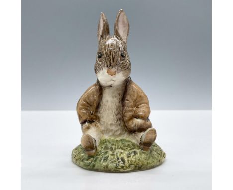 Glossy porcelain. The character is modeled in a brown jacket and fur. Royal Albert Beatrix Potter backstamp. This item has it