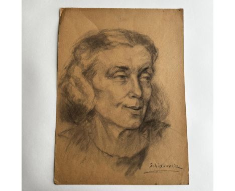 Original charcoal on brown laid paper featuring a three-quarter view Portrait of a Woman made in a realistic style. Signature