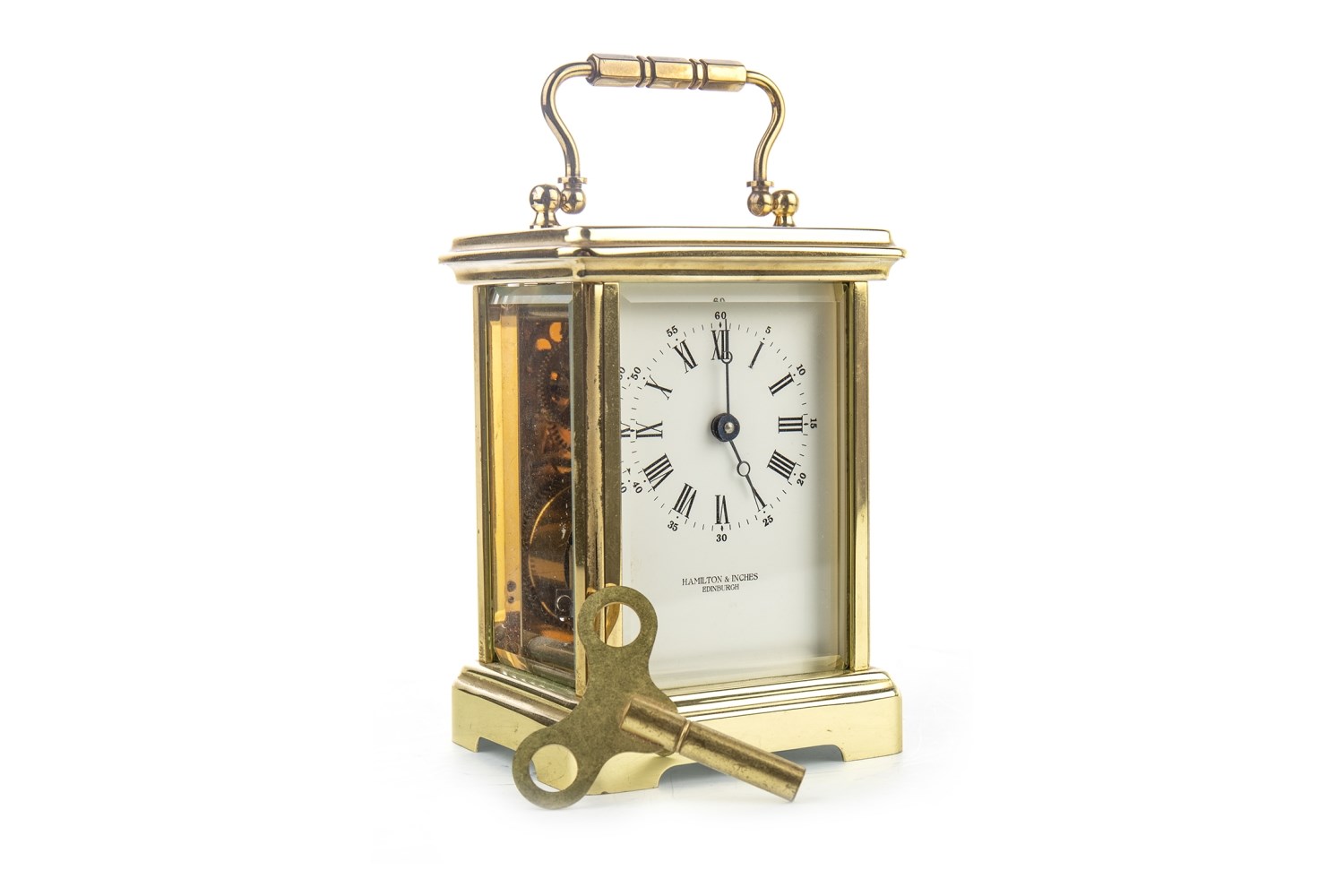 HAMILTON & INCHES BRASS CASED CARRIAGE CLOCK, the white dial with Roman