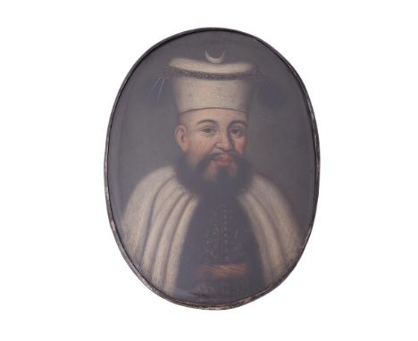 
	
		Manner of Jean-Baptiste Van Mour
		An Ottoman priest, wearing black and gold tunic, white cloak, white hat with crescent
