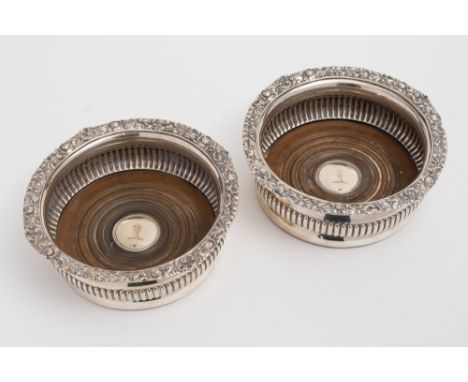 A pair of George IV silver coasters, maker WS possibly William Schofield, London 1823: crested, with shell and foliate decora