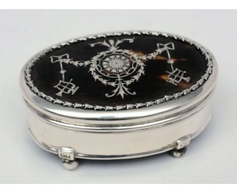 An Edward VII tortoiseshell and silver inlaid trinket box, London, 1909: of circular form with hinged lid and velvet lined in