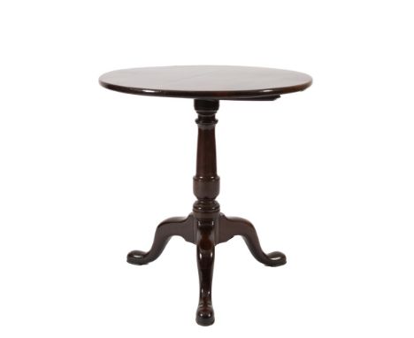 A mid 18th Century mahogany circular tea table:, with a snap top on turned vase-knopped column and tripod supports, terminati