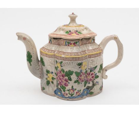 A Staffordshire polychrome salt glazed teapot and cover: of lobed form with serpent spout and scroll handle, moulded with pec