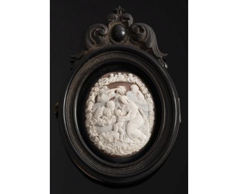 A late 19th century shell cameo mounted carved wood photograph container:, the oval hinged locket inset with an oval cameo 68