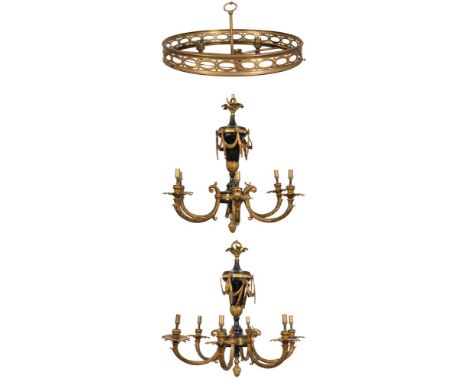 A pair of gilt brass and simulated black marble six branch chandeliers:, the central urn shaped stems hung with swags of drap