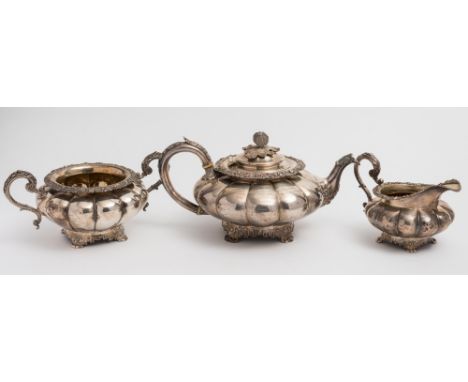 A George IV silver three-piece tea service,maker William Bateman II, London, 1829: inscribed, of lobed circular form, having 