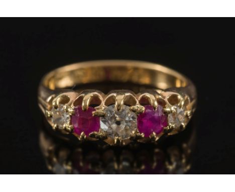 An 18ct gold, diamond and ruby five stone ring:, with graduated diamonds between cushion shaped rubies, in claw setting, ring