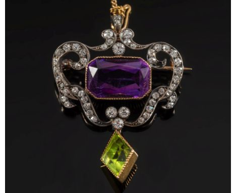 An Edwardian amethyst, diamond and peridot pendant/brooch:, the central, rectangular amethyst approximately 15mm x 9mm, withi