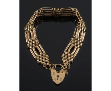 A 9ct gold four bar, gate-link bracelet: with padlock clasp and safety chain, approximately 40gms gross weight. 